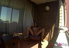 Sara Ray masturbates on a balcony for everyone in Madrid to see. Want to watch her play with that dildo in public?