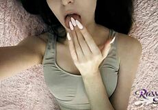 A sexy little girl undresses and pleases herself