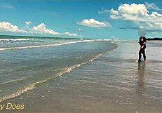 Wife strips nude for football on public clothed beach.