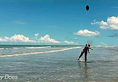 Wife strips nude for football on public clothed beach.