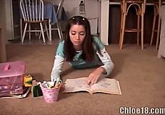 The teen pokes a crayon into her tight cunt