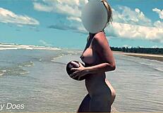 Wife strips nude for football on public clothed beach.