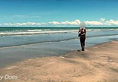 Wife strips nude for football on public clothed beach.