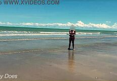 Wife strips nude for football on public clothed beach.