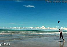 Wife strips nude for football on public clothed beach.