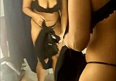 sarah rosa experiments with outfits in the store's fitting room