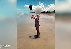 Wife strips nude for football on public clothed beach.