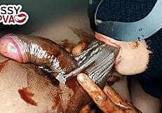 horny teen girlfriend licking black balls with chocolate syrup at christmas