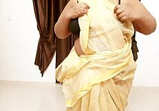 Chubby Asian aunt reveals her fat tits in sexy display