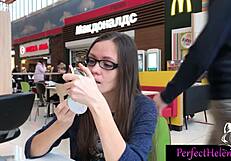 A young brunette woman engages in public interactions with strangers at the resort, leading to an unexpected encounter