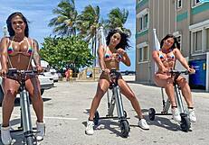 big ass latinas ride electric trikes at public beach big booty