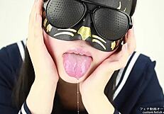 Asian babe indulges in wild tongue spitting fetish with dripping saliva.