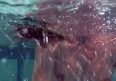 Ivetta plays in the pool, daring you to watch her every move