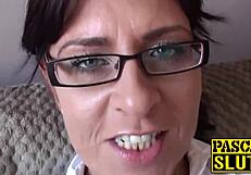 attractive busty milf relaxes on sofa