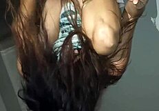 Close up of an ass shaking in a public place while being fucked by a black dildo