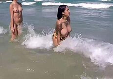 i walk on the sand with my big tits