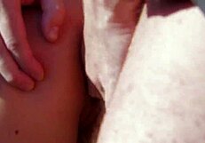 A man comes over to a woman who is tanning herself and they have sex