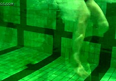 Kristina Andreeva, a brunette teen, swims naked in the pool