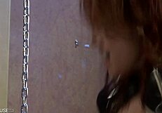 Redhead mistress Monica Mayhem enjoys BDSM with slave