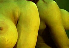 Busty ginger intriguingly flexes big muscles in the mirror