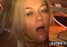 A mature woman and a young woman both use a dildo while in a car and in a cabin with multiple men giving them pleasure