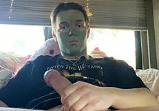 fit guy strokes cock while doing skin care