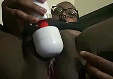 A Goth black beauty enjoys using a vibrator
