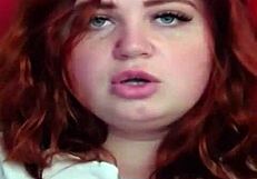 Red-haired beauty from Russia showing off her hourglass figure