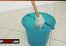A MILF masturbates while cleaning the house