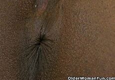 an older british woman undresses in a fun solo striptease