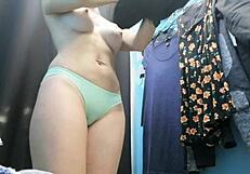 Russian beauty with huge boobs changes in dressing room