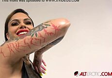 Busty Tattooed Brunette Genevieve Sinn Shares Backstage Interview Details About Her Erotic Ass And Big Tits.