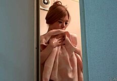 Young Japanese Girl Undresses In Shower For Webcam Exposure