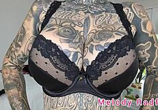 melody radford tries on black lingerie.