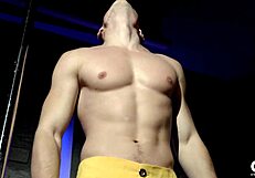 Hot guy does acrobatic pole dance