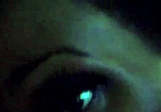 Ebony woman performing oral on a large black phallus