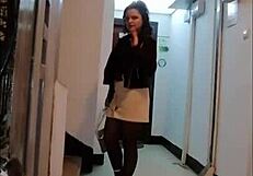 Femdom in leather catsuit and pantyhose with miniskirt