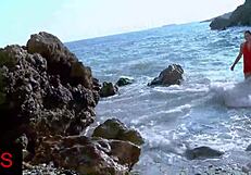 does this brunette's shaved pussy get fingered at seaside?