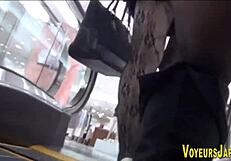 Asian babe feels excited as she's followed in public upskirt