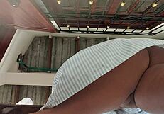 Ebony maid’s big ass peeks from under her skirt while working. Her curves steal the show.
