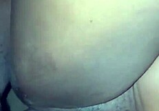 Curvy figure in Christmas setting bends over for gift.