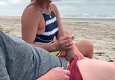 A woman gives a blowjob and an anal sex in public to a couple of strangers