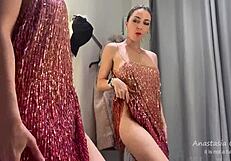 hot blonde slut tries on clothes, showing off her big ass in public fitting room