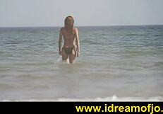 surfer guy fingers himself on the beach