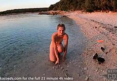 nude fire dancer seduces on beach at sunset