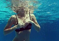 Kittina ivory swims in the pool and undresses
