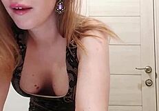 Blonde MILF sucks dildo and caresses wet pussy in restroom