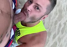 Watch the gay blowjob on the beach