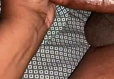 A husband gives his wife a handjob leading to a cumshot in their bedroom.