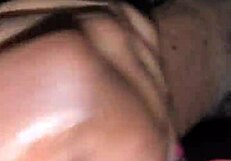 A husband gives his wife a handjob leading to a cumshot in their bedroom.